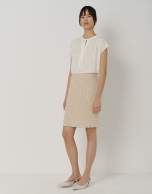 Sand-colored short tweed skirt with fringed hem