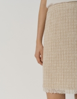 Sand-colored short tweed skirt with fringed hem