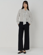 Blouse with bow and black and white dotted print