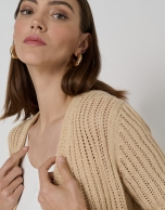 Long cream-colored ribbed knit jacket