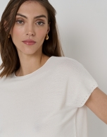 Off-white knit sweater with bat sleeves