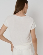 Off-white knit sweater with bat sleeves