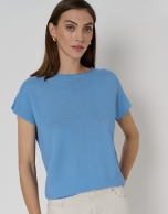 Blue knit sweater with bat sleeves