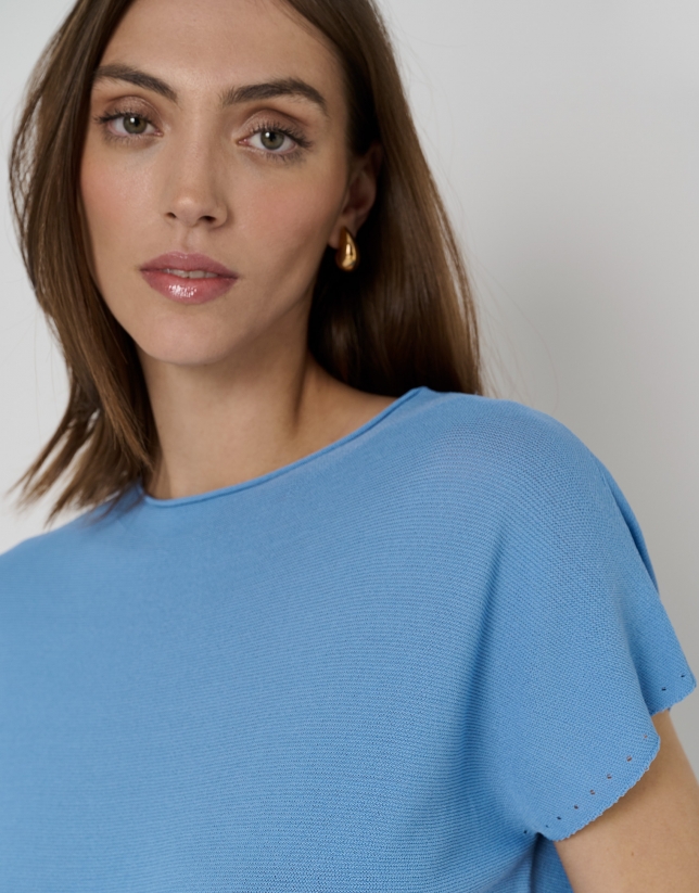 Blue knit sweater with bat sleeves