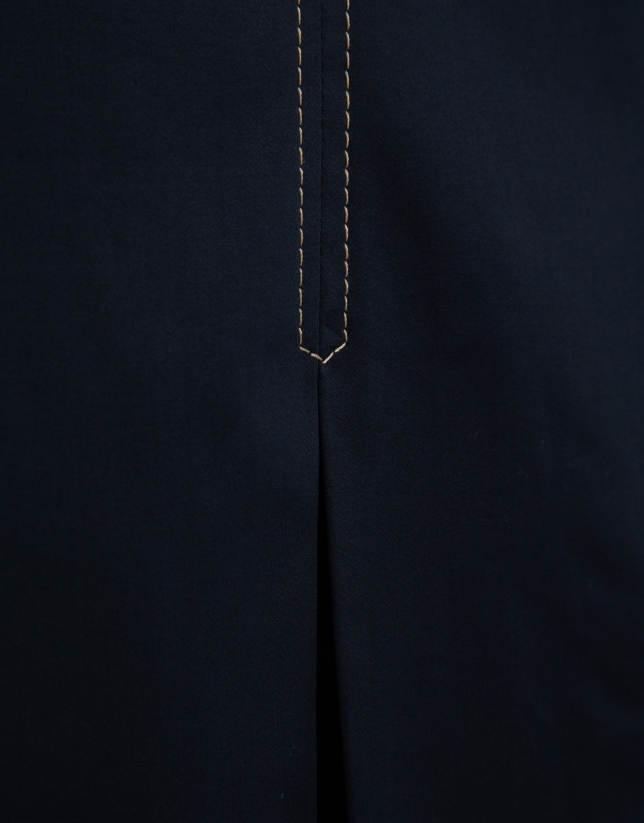 Navy blue skirt with slit and beige back-stitching