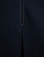 Navy blue skirt with slit and beige back-stitching