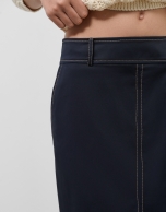 Navy blue skirt with slit and beige back-stitching