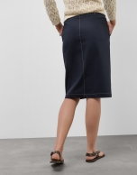 Navy blue skirt with slit and beige back-stitching