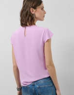 Pink short sleeve blouse with mini ruffles on the front