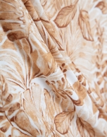 Beige crossover top with floral print
