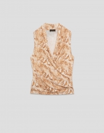 Beige crossover top with floral print