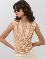 Beige crossover top with floral print