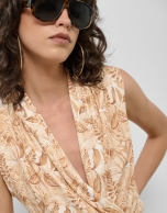 Beige crossover top with floral print