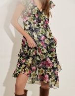 Green georgette crepe dress with an asymmetric cut, frills and floral print