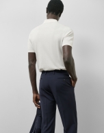 Structured white knitted polo shirt
