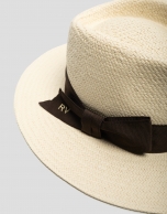 Beige hat with narrow brim and brown ribbon