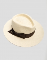 Beige hat with narrow brim and brown ribbon