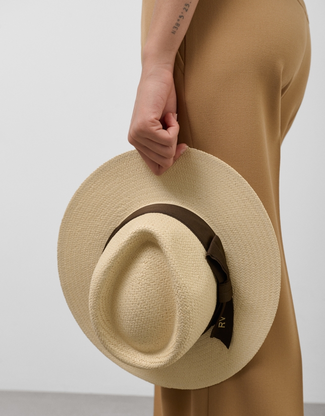 Beige hat with narrow brim and brown ribbon