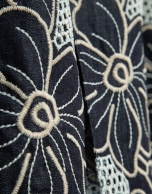 Blue midi denim skirt with floral embroidery and openwork