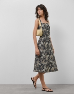 Blue denim halter midi dress with floral embroidery and openwork