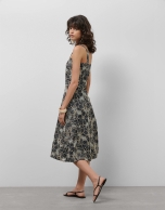 Blue denim halter midi dress with floral embroidery and openwork
