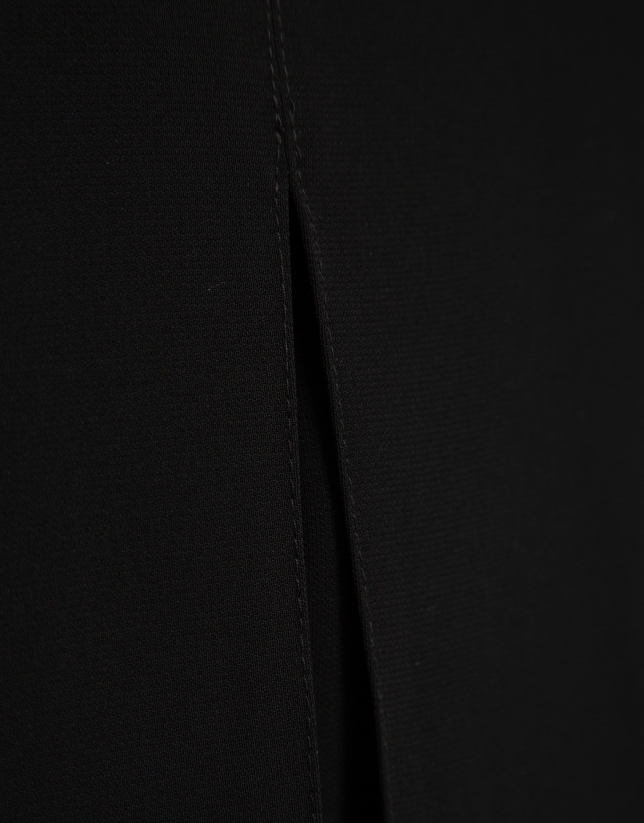 Wide-legged black crepe trousers with slit