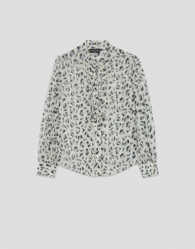 Blouse with ruffles on the chest and a grey spot print