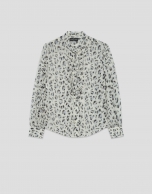 Blouse with ruffles on the chest and a grey spot print