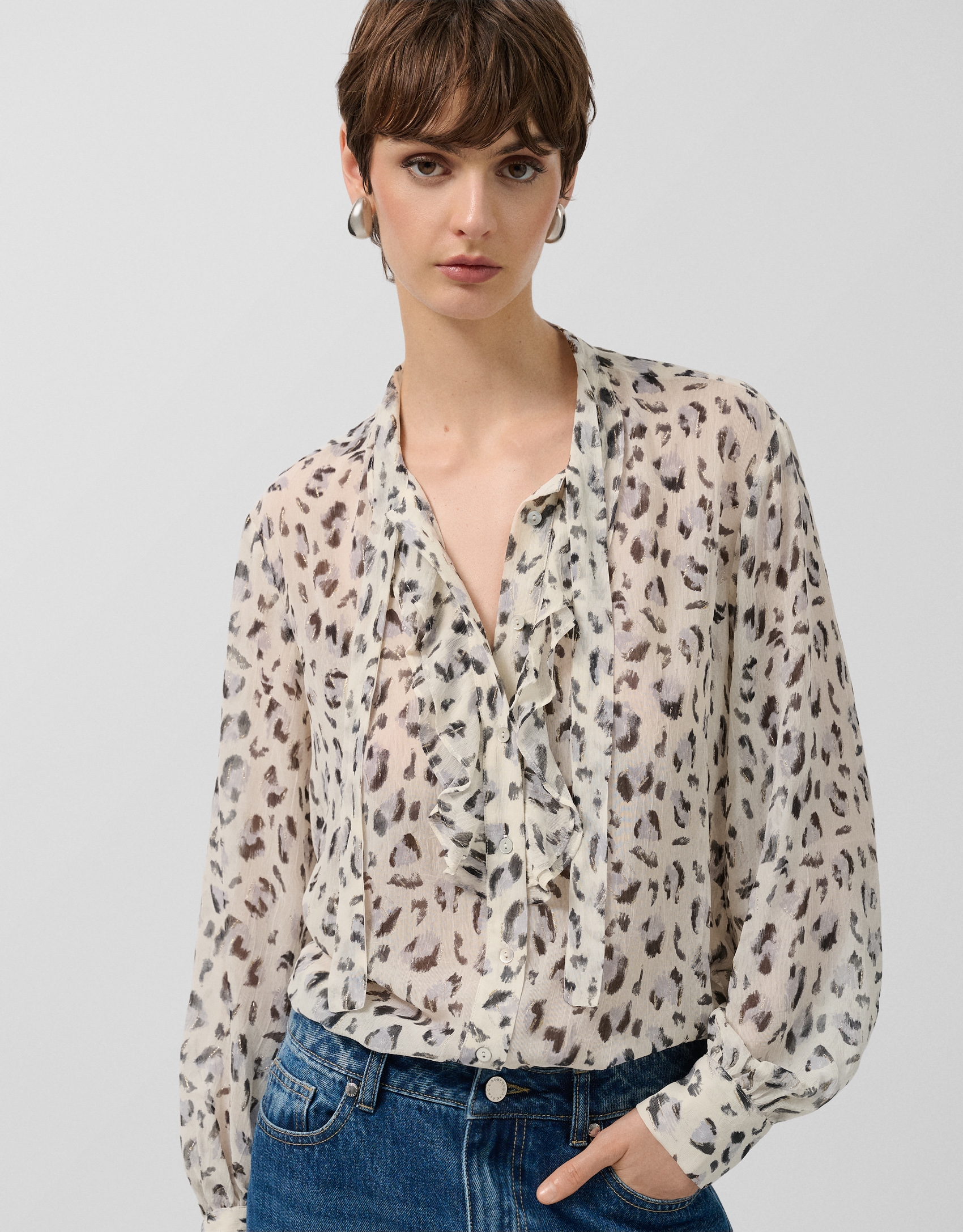 Grey spotted print blouse with ruffles on the front