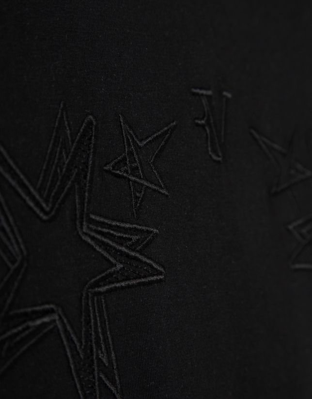 Camiseta sin mangas oversize negra con estrellas