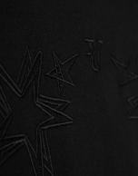 Camiseta sin mangas oversize negra con estrellas