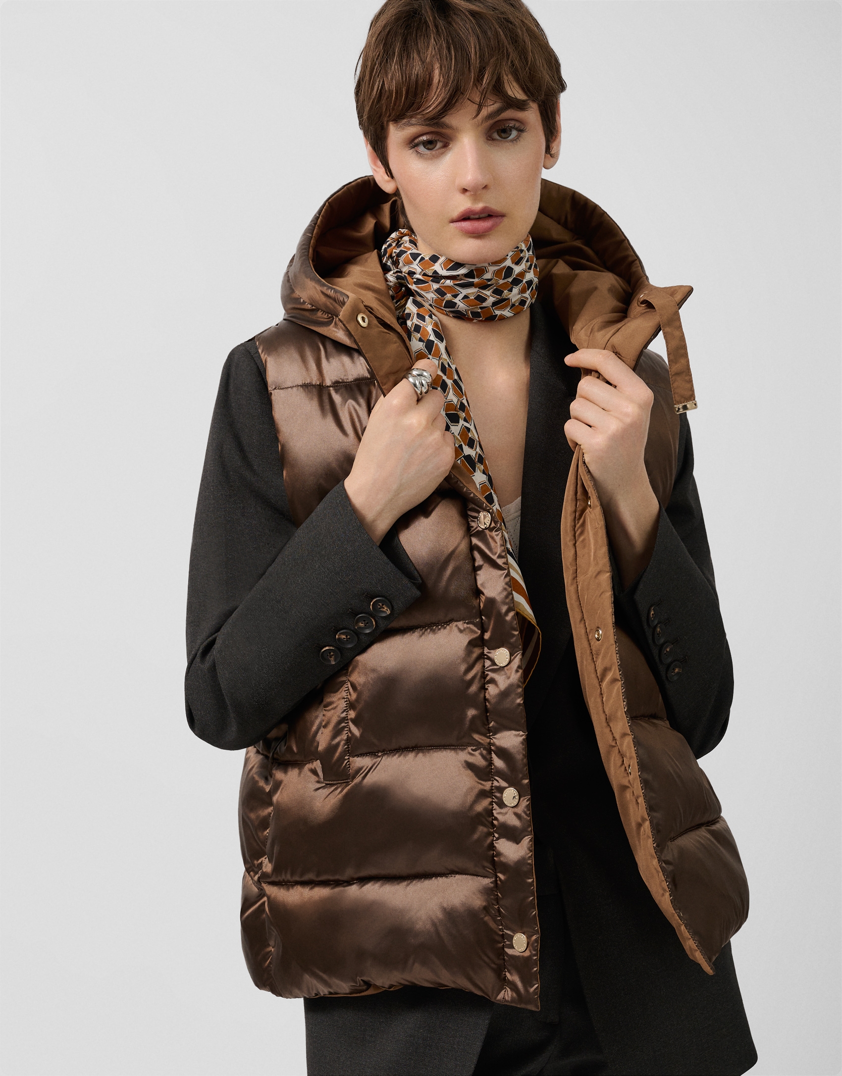 Brown padded vest with hood