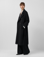 Long double-breasted coat in black cloth.