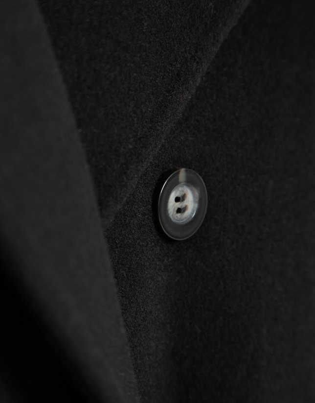 Long double-breasted coat in black cloth.