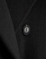 Long double-breasted coat in black cloth.