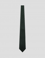 Green silk tie with white/navy geometric jacquard