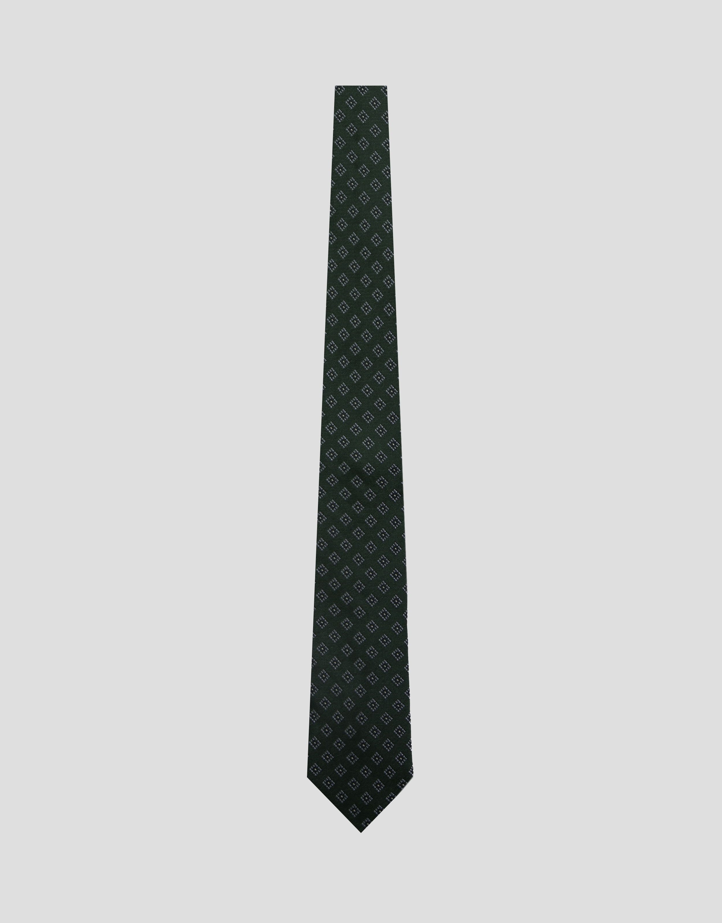Green silk tie with white/navy geometric jacquard