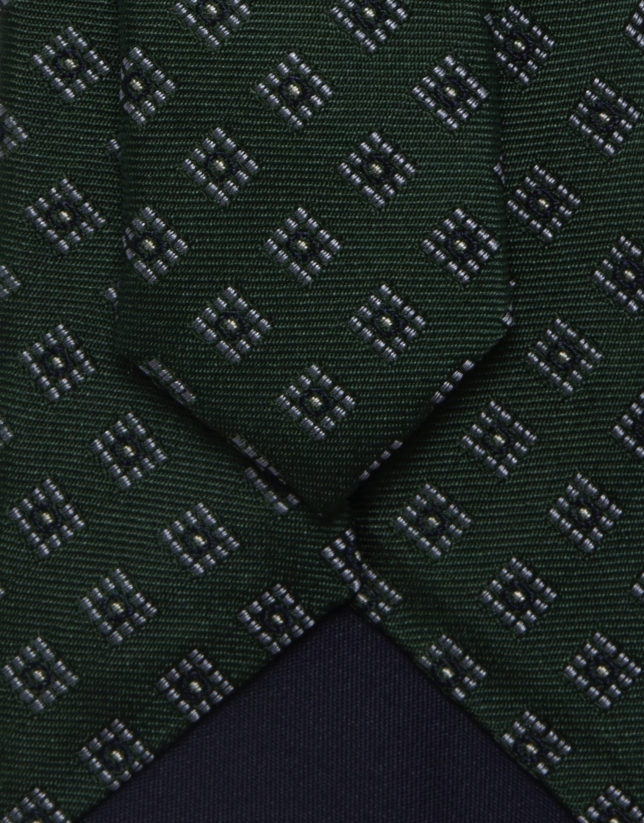 Green silk tie with white/navy geometric jacquard