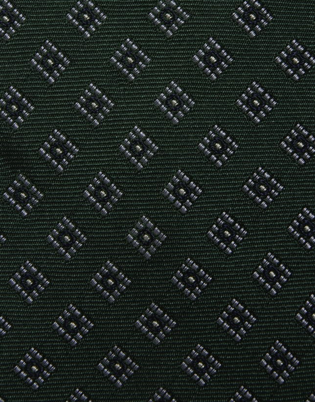 Green silk tie with white/navy geometric jacquard