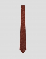 Red silk tie with jacquard flowers in blue tones