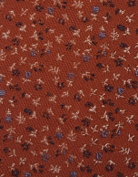 Red silk tie with jacquard flowers in blue tones