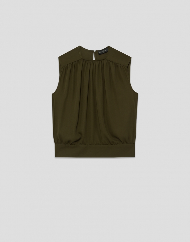 Sleeveless puffed blouse in green crepe