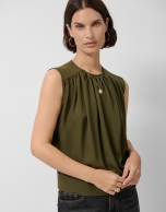 Sleeveless puffed blouse in green crepe