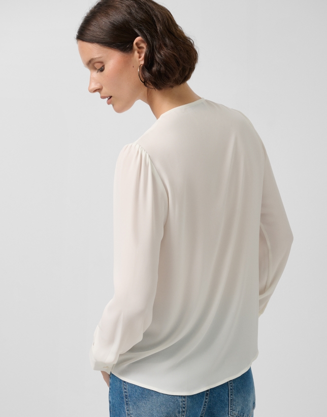Blusa manga larga crudo con volante