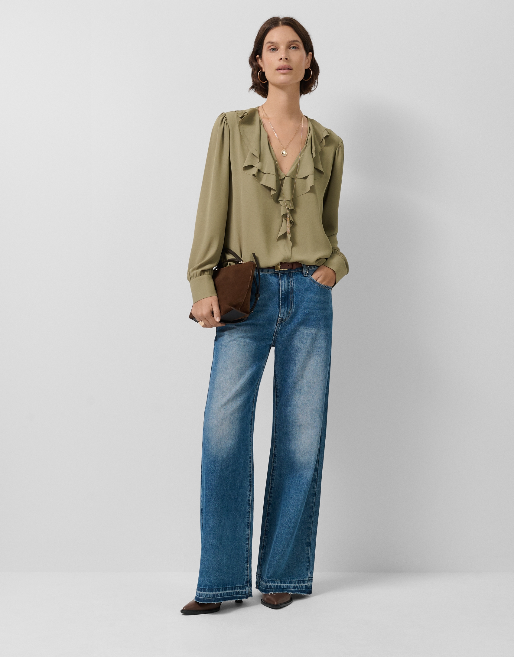 Green long-sleeved blouse with ruffle