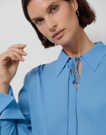 Blue crepe blouse with oversized cuffs
