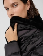 Short black quilted down jacket with fur collar