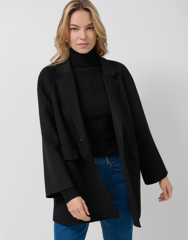 Short three-quarter length double-faced black coat