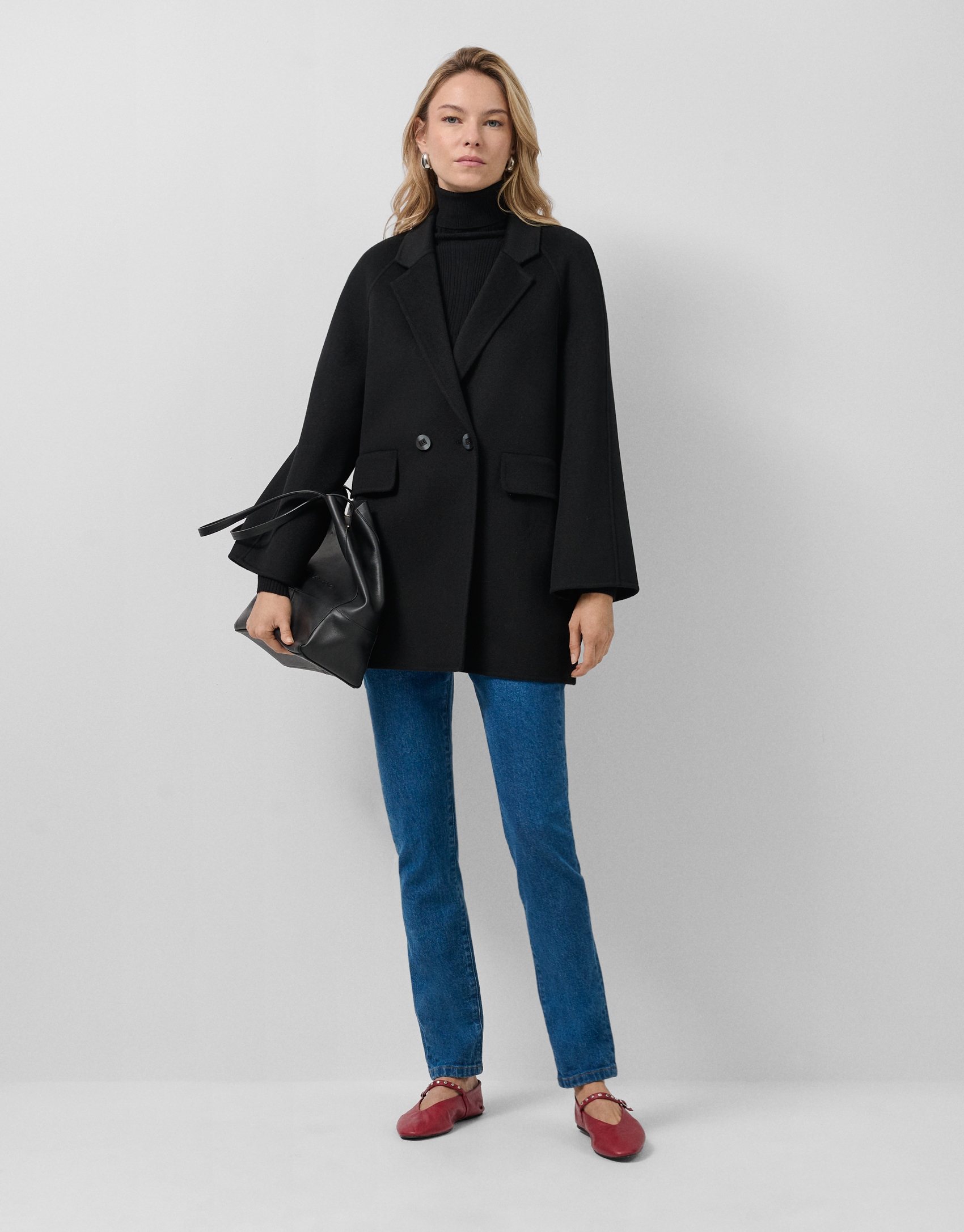 Short three-quarter length double-faced black coat