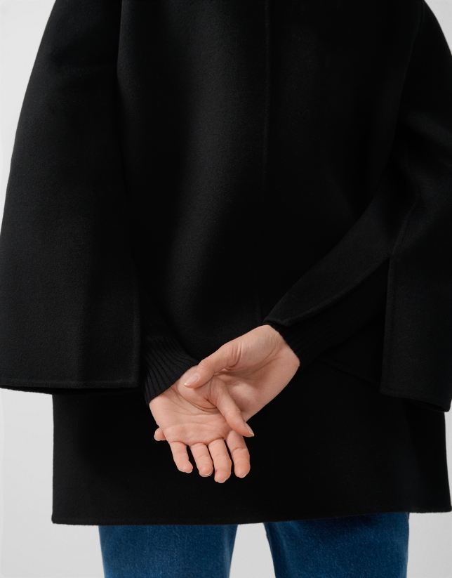 Short three-quarter length double-faced black coat